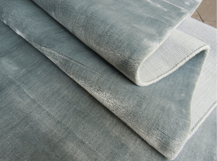 handmade plain blue rug
