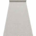 Berber Bahari wool runner rug rolled up on a white background