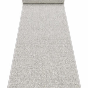 Berber Bahari wool runner rug rolled up on a white background