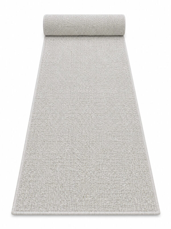 Berber Bahari wool runner rug rolled up on a white background