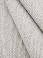 Berber Bahari wool rug rolled up showing texture