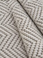 Nova indoor-outdoor rug rolled up showing woven texture