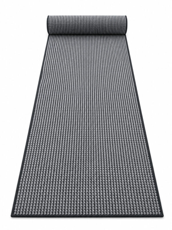 Busk Black wool runner rug rolled up on a white background