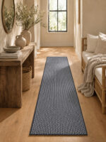 Busk Black wool runner rug styled in a hallway