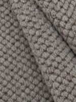Linen Wool wool rug rolled up showing texture