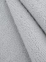 Natural Flair Pampas Grey wool rug rolled up showing texture
