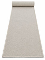 Sandstone wool runner rug rolled up on a white background