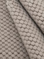 Wool Cotton wool rug rolled up showing texture