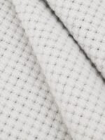 Wool Fleece White wool rug rolled up showing texture