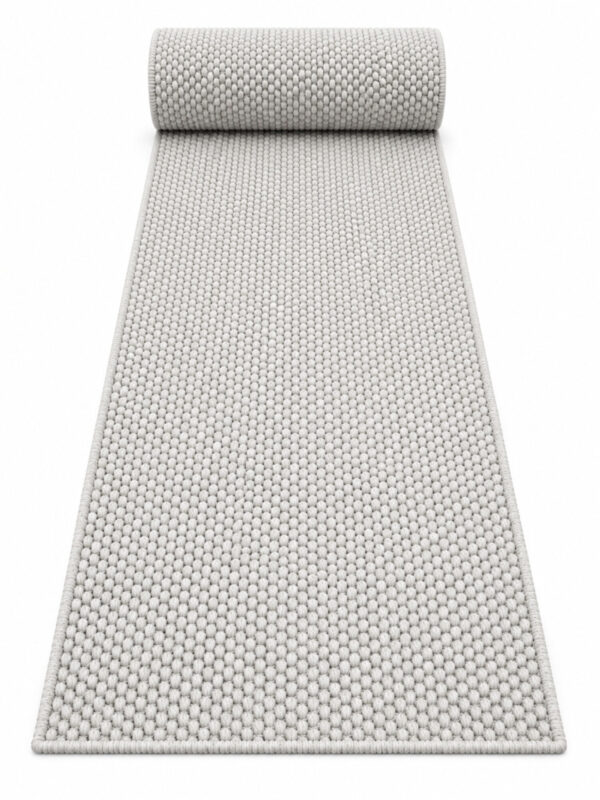 Wool Twill wool runner rug rolled up on a white background
