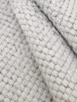 Wool Twill wool rug rolled up showing texture