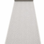 Wool Weave Herringbone wool runner rug rolled up on a white background