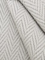 Wool Weave Herringbone wool rug rolled up showing texture